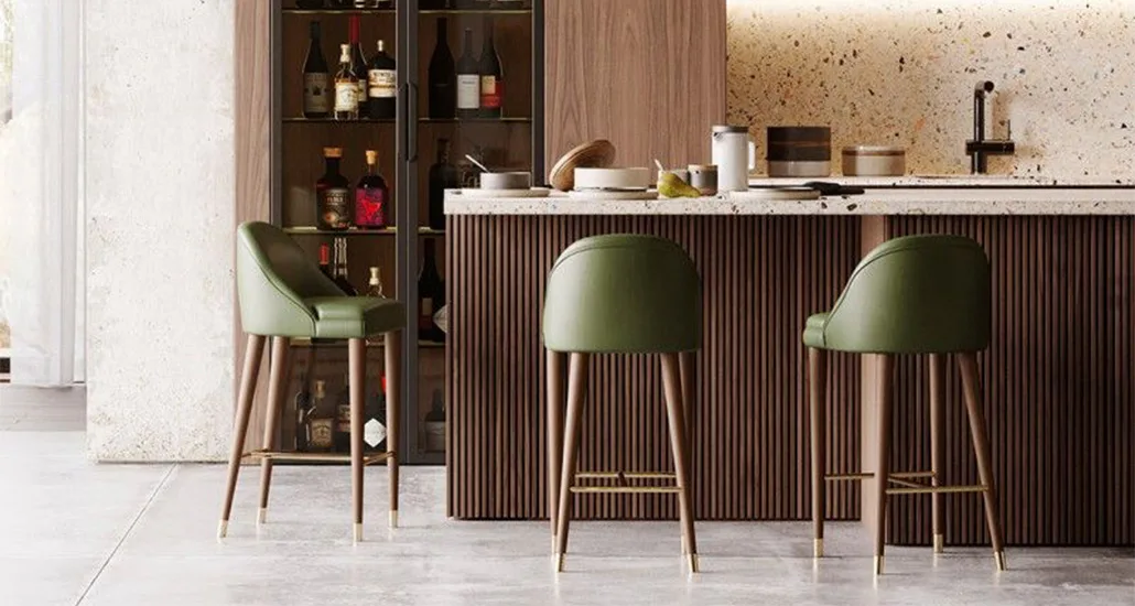 Estoril barstool is a contemporary upholstered barstool with metal caps suitable for hospitality and residential projects